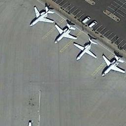 Figure with four airplanes parked.